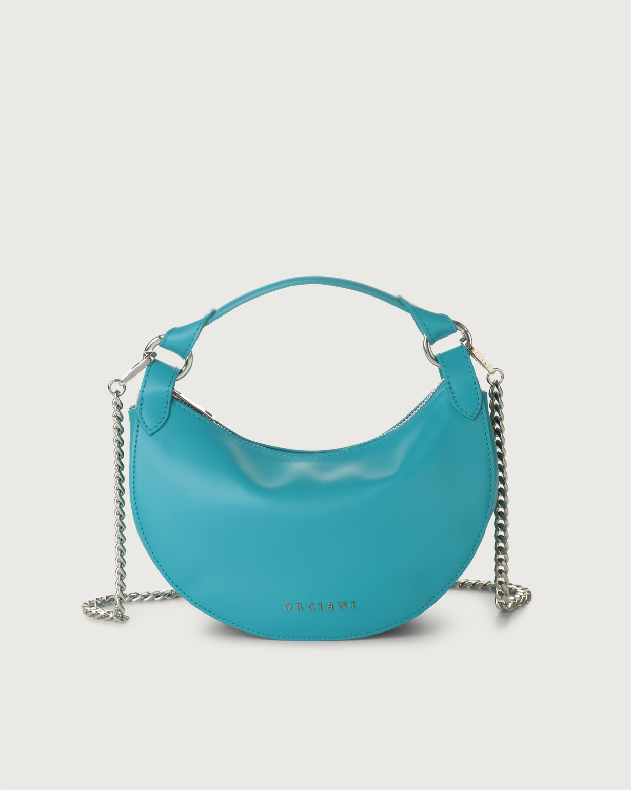 ORCIANI Dumpling Vanity leather mini bag with strap. color turquoise
